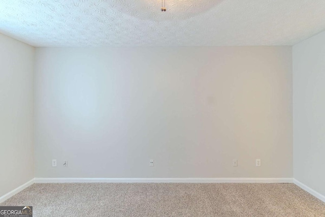 8051 Trinity Park Dr, Riverdale, GA 30296 - carpeted spare room with a textured ceiling and baseboards