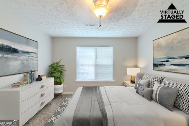 8051 Trinity Park Dr, Riverdale, GA 30296 - bedroom with a textured ceiling, baseboards, visible vents, and carpet