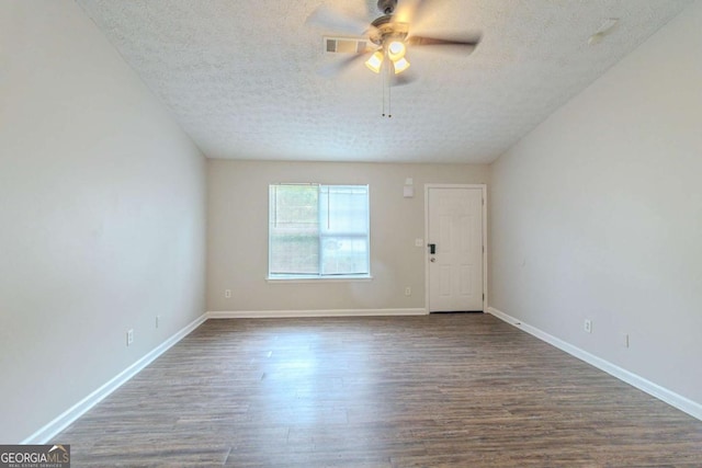 8051 Trinity Park Dr, Riverdale, GA 30296 - unfurnished room featuring dark wood-style floors, a textured ceiling, baseboards, and a ceiling fan