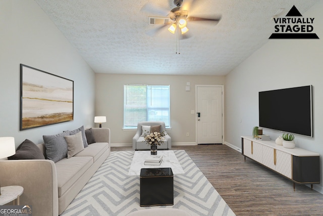 8051 Trinity Park Dr, Riverdale, GA 30296 - living area with a ceiling fan, a textured ceiling, dark wood-type flooring, baseboards, and visible vents