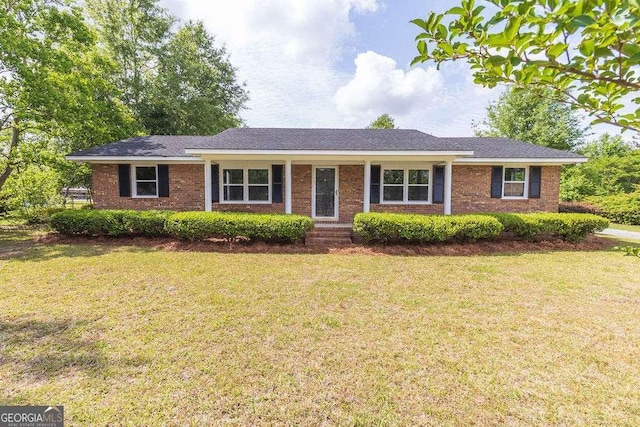 3088 Southwood Dr, Waycross, GA 31503 - ranch-style home with a front lawn and brick siding