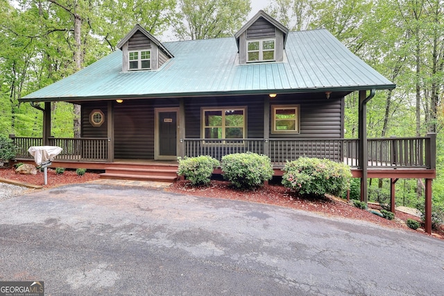 455 Old Cherokee Rd, Cleveland, GA 30528 - view of front of home with metal roof, faux log siding, and a porch