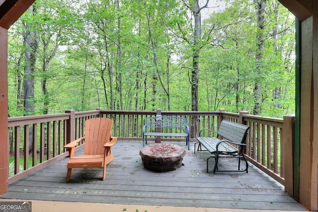 455 Old Cherokee Rd, Cleveland, GA 30528 - wooden deck featuring an outdoor fire pit and a view of trees