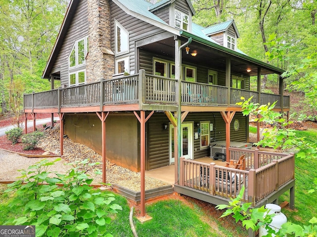 455 Old Cherokee Rd, Cleveland, GA 30528 - rear view of property with metal roof, a wooden deck, and log veneer siding