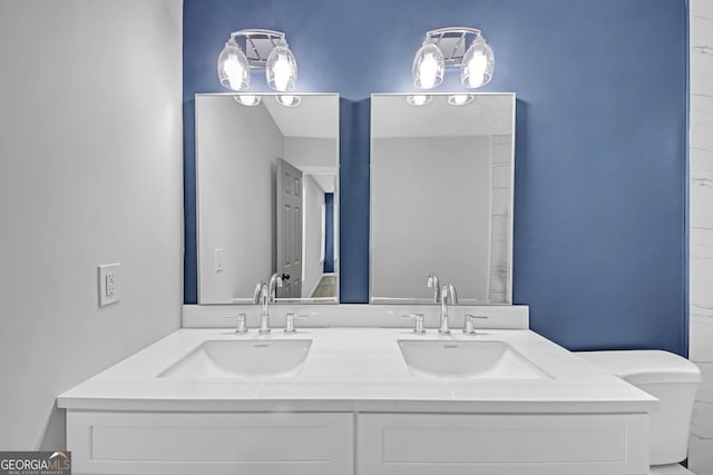 bathroom featuring double vanity and a sink