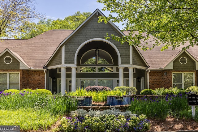 exterior space featuring brick siding