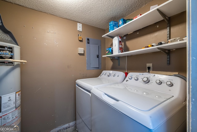 washroom with washer and dryer, laundry area, gas water heater, a textured ceiling, and electric panel
