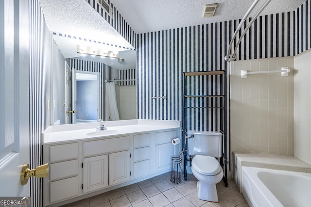 bathroom featuring tile patterned flooring, vanity, toilet, a textured ceiling, and wallpapered walls