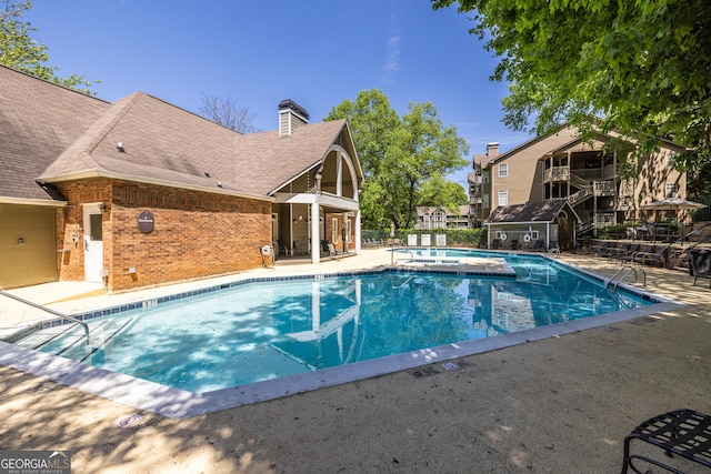 community pool with a patio