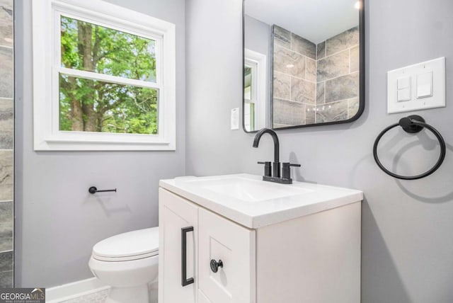 208 Silver Springs Cir SW, Atlanta, GA 30310 - bathroom with toilet, baseboards, and vanity