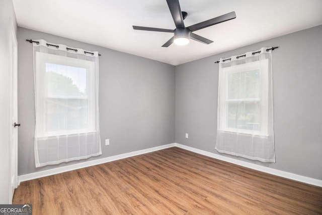 208 Silver Springs Cir SW, Atlanta, GA 30310 - unfurnished room with baseboards, a ceiling fan, and wood finished floors