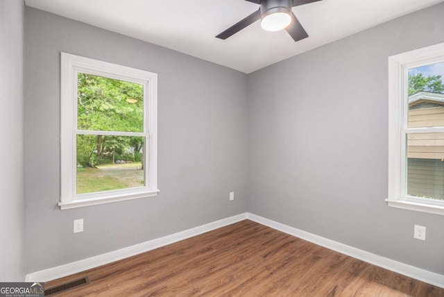 208 Silver Springs Cir SW, Atlanta, GA 30310 - unfurnished room with baseboards, visible vents, plenty of natural light, and wood finished floors
