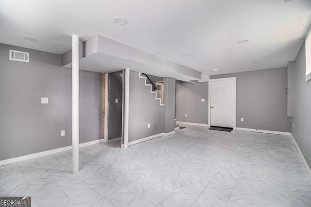 208 Silver Springs Cir SW, Atlanta, GA 30310 - finished below grade area featuring visible vents, marble finish floor, baseboards, and stairway