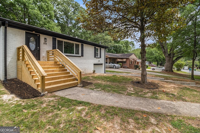 208 Silver Springs Cir SW, Atlanta, GA 30310 - view of front of house featuring brick siding, a garage, and concrete driveway