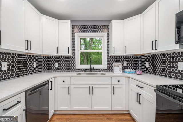 208 Silver Springs Cir SW, Atlanta, GA 30310 - kitchen featuring a sink, tasteful backsplash, black appliances, and white cabinets