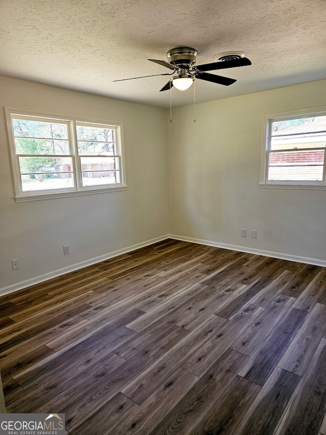 802 Colquitt Cir, Albany, GA 31707 - empty room featuring dark wood finished floors, baseboards, ceiling fan, and a textured ceiling