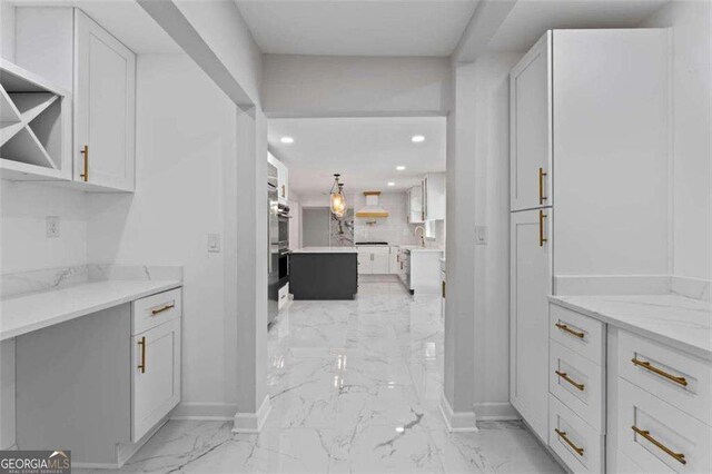 2023 Stoneleigh Dr, Stone Mountain, GA 30087 - interior space featuring baseboards, recessed lighting, white cabinetry, and marble finish floor