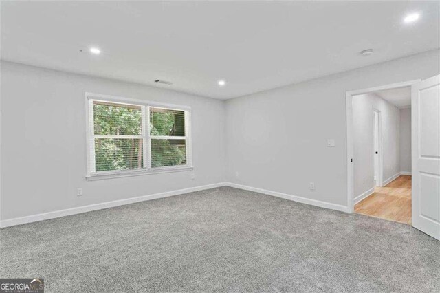 2023 Stoneleigh Dr, Stone Mountain, GA 30087 - empty room featuring recessed lighting, visible vents, carpet floors, and baseboards