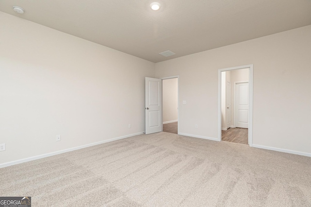 267 Oliver Dr, Locust Grove, GA 30248 - unfurnished bedroom with baseboards, visible vents, and carpet