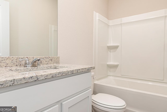 267 Oliver Dr, Locust Grove, GA 30248 - bathroom with toilet, shower / bathtub combination, and vanity
