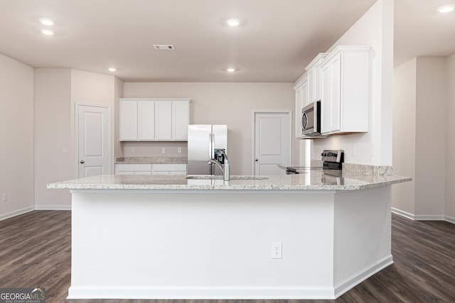 267 Oliver Dr, Locust Grove, GA 30248 - kitchen with appliances with stainless steel finishes, dark wood-style flooring, baseboards, and a sink