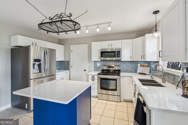 3979 Doral Cir, Atlanta, GA 30360 - kitchen featuring appliances with stainless steel finishes, a sink, light tile patterned floors, and light countertops