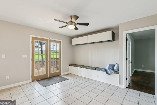 3979 Doral Cir, Atlanta, GA 30360 - mudroom with french doors, light tile patterned floors, a ceiling fan, and baseboards
