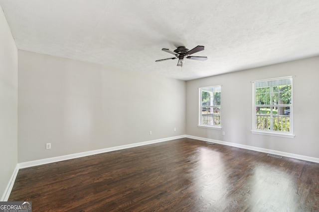 3979 Doral Cir, Atlanta, GA 30360 - spare room featuring ceiling fan, dark wood finished floors, and baseboards