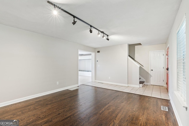 3979 Doral Cir, Atlanta, GA 30360 - spare room with light wood-type flooring, stairway, baseboards, and rail lighting