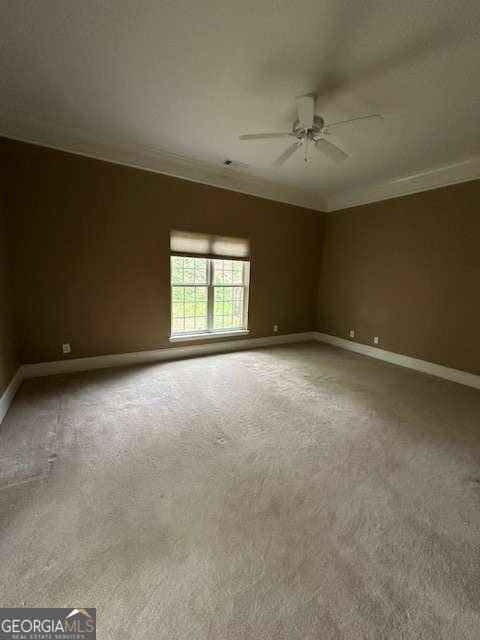 8010 Scudder Way, Ball Ground, GA 30107 - carpeted empty room with a ceiling fan and ornamental molding