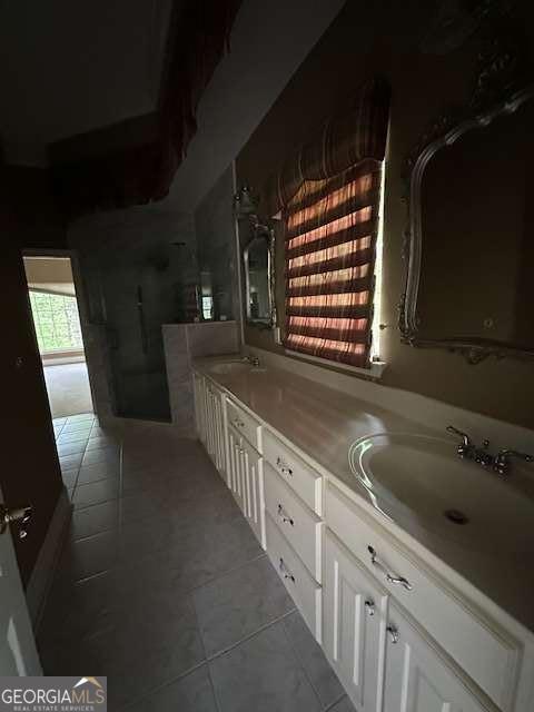 8010 Scudder Way, Ball Ground, GA 30107 - full bathroom with double vanity, walk in shower, tile patterned flooring, and a sink