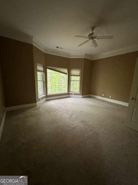 8010 Scudder Way, Ball Ground, GA 30107 - carpeted empty room with ceiling fan, crown molding, visible vents, and baseboards
