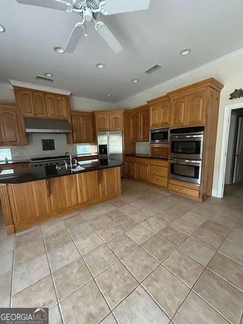 8010 Scudder Way, Ball Ground, GA 30107 - kitchen with stainless steel appliances, under cabinet range hood, light tile patterned floors, ornamental molding, and dark countertops
