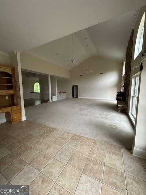 8010 Scudder Way, Ball Ground, GA 30107 - interior space featuring light tile patterned floors, high vaulted ceiling, and light carpet