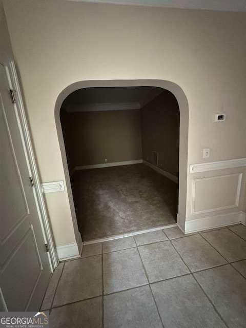 8010 Scudder Way, Ball Ground, GA 30107 - corridor featuring tile patterned floors and arched walkways