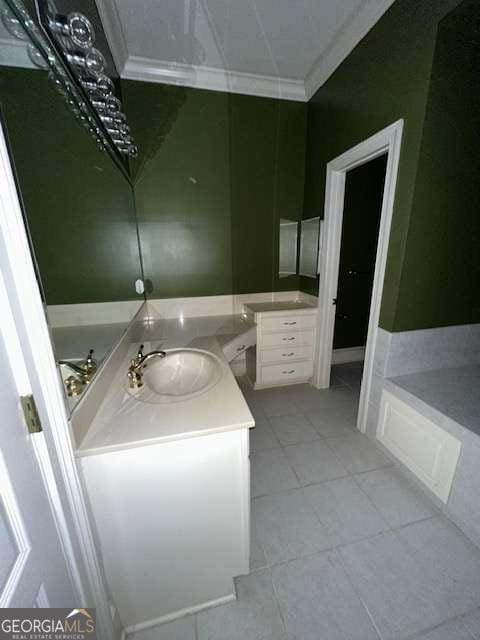 8010 Scudder Way, Ball Ground, GA 30107 - bathroom featuring vanity, tile patterned floors, crown molding, and a tub to relax in