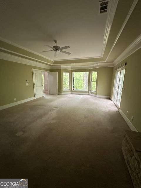 8010 Scudder Way, Ball Ground, GA 30107 - carpeted spare room featuring ornamental molding, a tray ceiling, and a ceiling fan