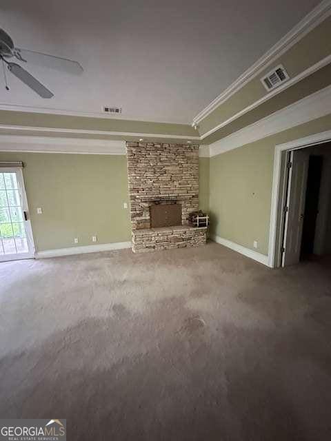 8010 Scudder Way, Ball Ground, GA 30107 - unfurnished living room with carpet, baseboards, visible vents, a ceiling fan, and crown molding