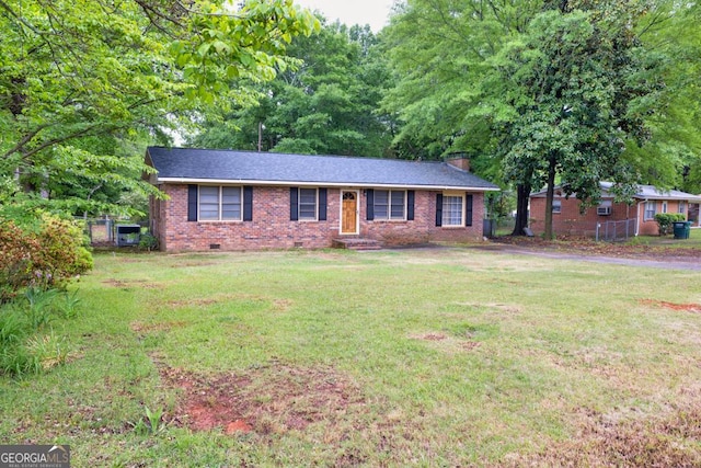 98 Orchard Cir, Commerce, GA 30529 - ranch-style home featuring a front yard, crawl space, a chimney, and brick siding