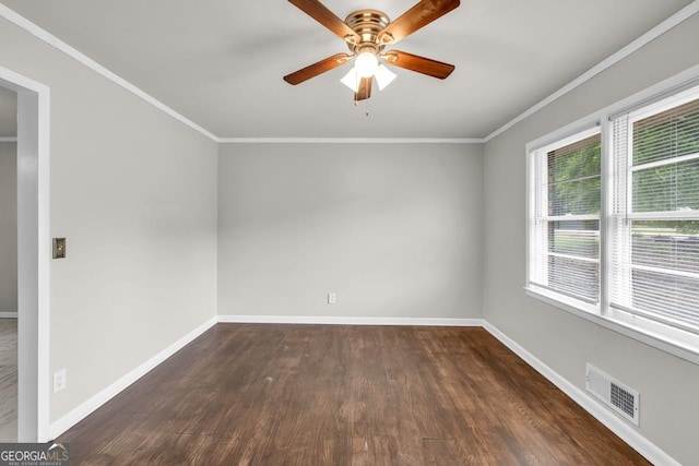 98 Orchard Cir, Commerce, GA 30529 - unfurnished room with baseboards, ornamental molding, dark wood-style floors, visible vents, and a ceiling fan