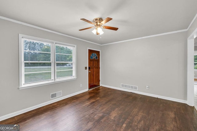 98 Orchard Cir, Commerce, GA 30529 - entrance foyer with dark wood finished floors, visible vents, ceiling fan, and crown molding