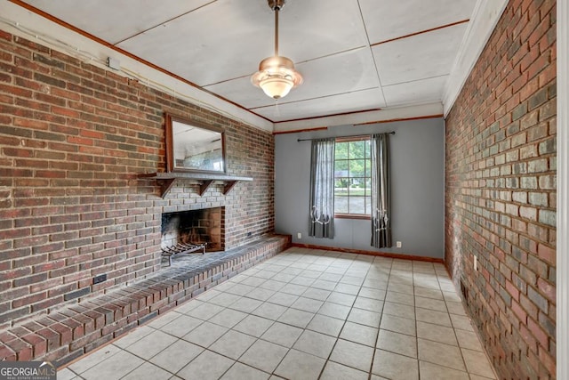 98 Orchard Cir, Commerce, GA 30529 - unfurnished living room with light tile patterned floors, baseboards, brick wall, ornamental molding, and a brick fireplace