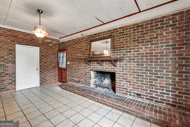 98 Orchard Cir, Commerce, GA 30529 - unfurnished living room featuring a brick fireplace, tile patterned flooring, and brick wall