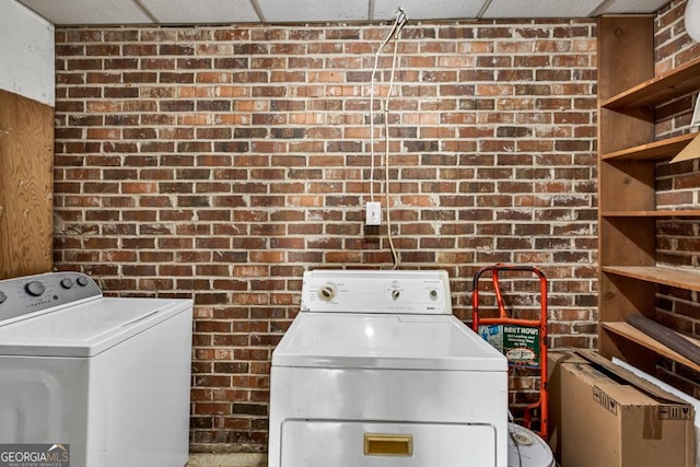 98 Orchard Cir, Commerce, GA 30529 - laundry room with washer and clothes dryer and brick wall