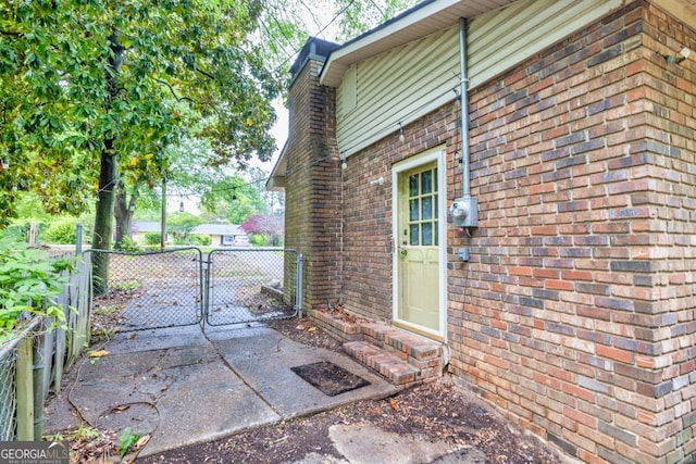 98 Orchard Cir, Commerce, GA 30529 - view of property exterior featuring fence, a gate, entry steps, and brick siding