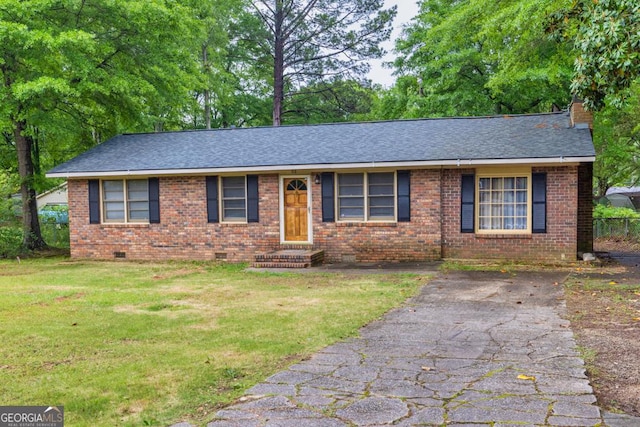 98 Orchard Cir, Commerce, GA 30529 - ranch-style home featuring a front yard, crawl space, a shingled roof, brick siding, and a chimney