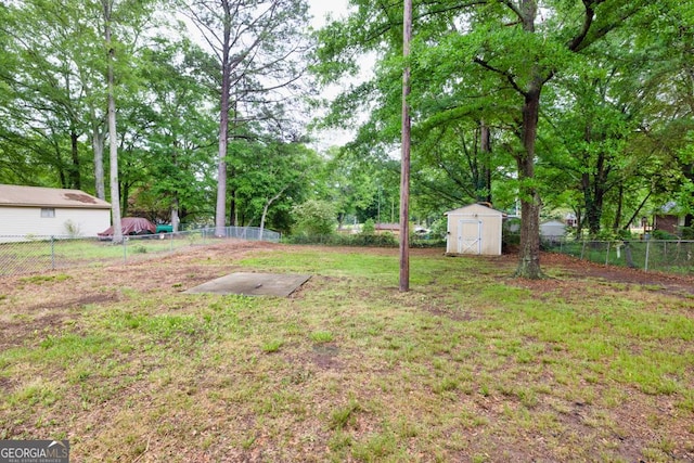 98 Orchard Cir, Commerce, GA 30529 - view of yard with an outdoor structure, a shed, and a fenced backyard