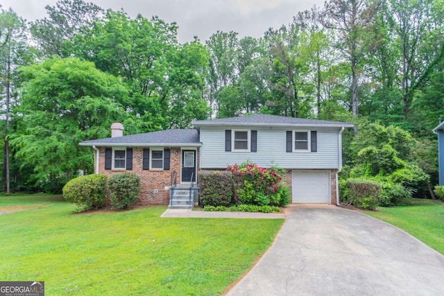 3664 Satellite Ter, Ellenwood, GA 30294 - tri-level home featuring an attached garage, brick siding, driveway, and a chimney