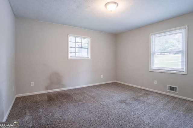 3664 Satellite Ter, Ellenwood, GA 30294 - carpeted empty room featuring visible vents and baseboards