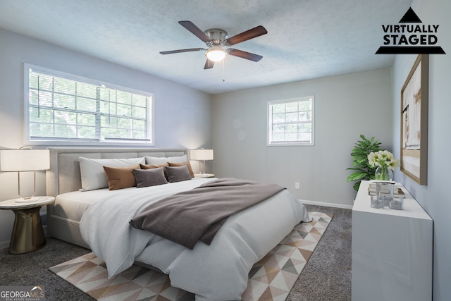 3664 Satellite Ter, Ellenwood, GA 30294 - bedroom featuring a textured ceiling, light carpet, baseboards, and a ceiling fan